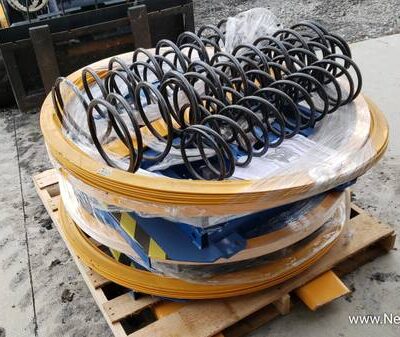 Spring-Actuated Pallet Carousel Skid Positioner